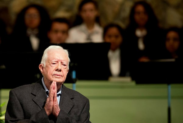 FILE - Former President Jimmy Carter teaches Sunday school class at Maranatha Baptist Church in his hometown, Aug. 23, 2015, in Plains, Ga. The 90-year-old Carter gave one lesson to about 300 people filling the small Baptist church that he and his wife, Rosalynn, attend. It was Carter's first lesson since detailing the intravenous drug doses and radiation treatment planned to treat melanoma found in his brain after surgery to remove a tumor from his liver. (AP Photo/David Goldman, File)