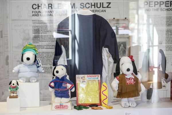 Figurines representing Snoopy wear creations as part of Peanuts' 75th Anniversary, at the Snoopy In Style exhibition that runs from March 22 through April 5, in Paris Thursday, March 20, 2025. (AP Photo/Thomas Padilla)