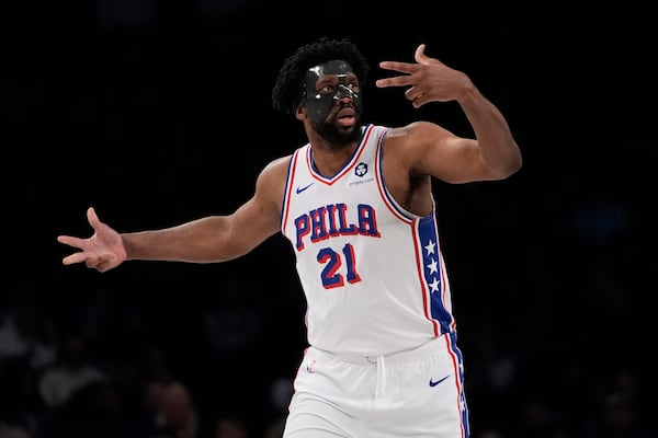 Philadelphia 76ers' Joel Embiid (21) gestures after making a three-point shot during the second half of an NBA basketball game against the Brooklyn Nets Saturday, Jan. 4, 2025, in New York. (AP Photo/Frank Franklin II)