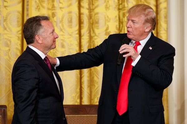 FILE - President Donald Trump speaks to businessman Steve Witkoff, who lost his son Andrew to a prescription drug overdose, during the White House Opioid Summit in the East Room of the White House, March 1, 2018, in Washington. (AP Photo/Evan Vucci, File)