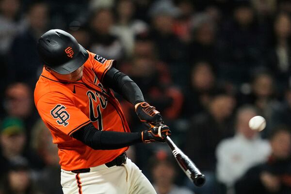 San Francisco Giants' Wilmer Flores hits a three-run home run during the sixth inning of a baseball game against the Athletics, Friday, May 16, 2025, in San Francisco. (AP Photo/Godofredo A. Vásquez)