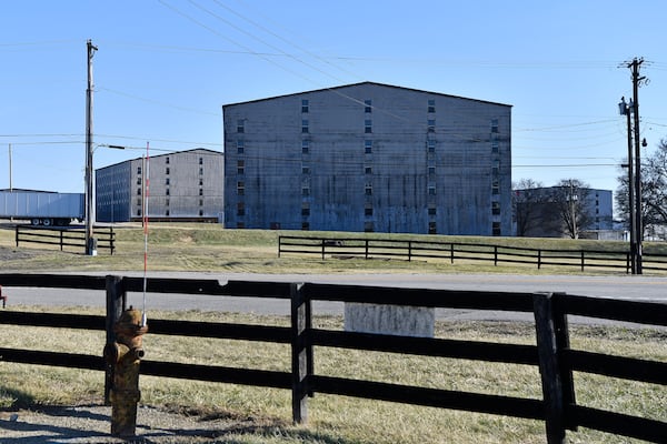 Bourbon barrel rack houses sit on a hillside at the Wild Turkey Distillery in Lawrenceburg, Ky., Monday, Feb. 3, 2025. (AP Photo/Timothy D. Easley)