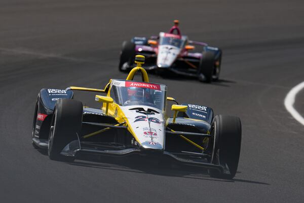 Colton Herta drives through the first turn during practice for the Indianapolis 500 auto race at Indianapolis Motor Speedway in Indianapolis, Thursday, May 15, 2025. (AP Photo/Michael Conroy)
