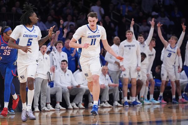 Creighton celebrates a three-point shot by Ryan Kalkbrenner (11) during the second half of an NCAA college basketball game against DePaul at the Big East basketball tournament Thursday, March 13, 2025, in New York. (AP Photo/Frank Franklin II)