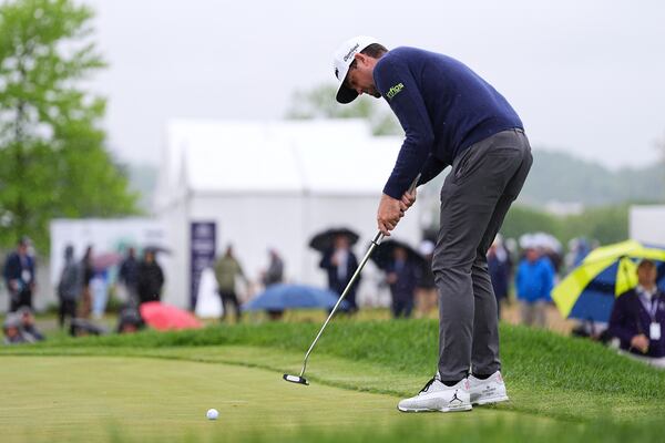 Keegan Bradley putts on the tenth hole during the second round of the Truist Championship golf tournament at the Philadelphia Cricket Club, Friday, May 9, 2025, in Flourtown. (AP Photo/Matt Rourke)