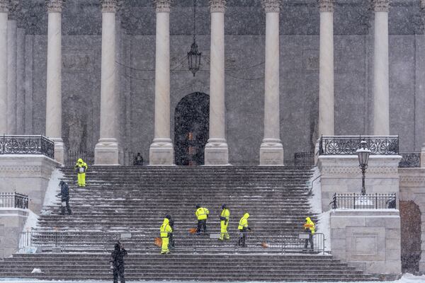 FILE - Workers clear steps at the Capitol in Washington, Monday, Jan. 6, 2025. (AP Photo/J. Scott Applewhite, File)