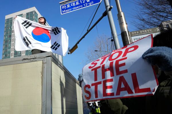 A supporter of impeached South Korean President Yoon Suk Yeol attends a rally to oppose his impeachment outside the Seoul Western District Court in Seoul, South Korea, Saturday, Jan. 18, 2025. (AP Photo/Ahn Young-joon)