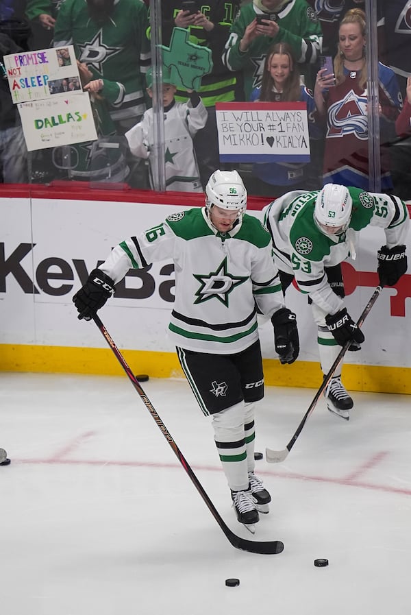 Dallas Stars right wing Mikko Rantanen warms up before an NHL hockey game against his former team, the Colorado Avalanche, Sunday, March 16, 2025, in Denver. (AP Photo/David Zalubowski)