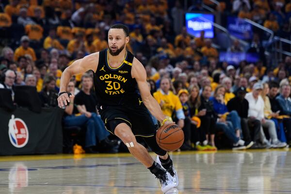 Golden State Warriors guard Stephen Curry moves the ball during the first half of Game 6 of an NBA basketball first-round playoff series against the Houston Rockets, Friday, May 2, 2025, in San Francisco. (AP Photo/Godofredo A. Vásquez)
