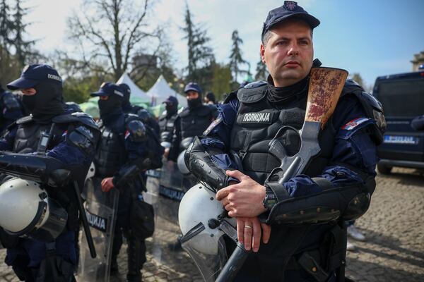 Police officers stand guard prior to a an anti-corruption rally in Belgrade, Serbia, Saturday, March 15, 2025. (AP Photo/Armin Durgut)