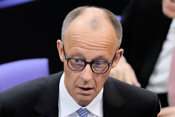 Friedrich Merz reacts after he was not elected new Chancellor in the first voting process at the parliament Bundestag in Berlin, Tuesday, May 6, 2025. (AP Photo/Markus Schreiber)