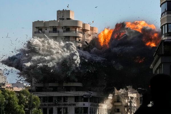 FILE - Smoke and flames erupt from a building hit in an Israeli airstrike in Chiyah, in the southern suburb of Beirut, Lebanon, Friday, Nov. 22, 2024. (AP Photo/Bilal Hussein, File)