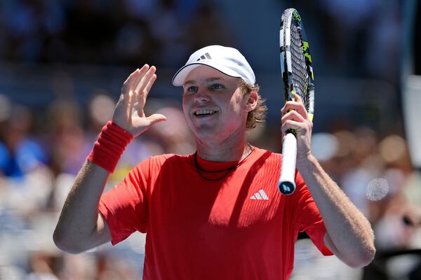 Alex Michelsen of the U.S. reacts after defeating Karen Khachanov of Russia in their third round match at the Australian Open tennis championship in Melbourne, Australia, Saturday, Jan. 18, 2025. (AP Photo/Ng Han Guan)