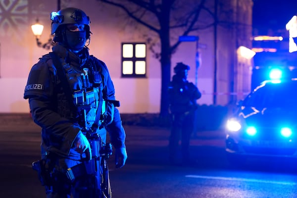 Police officers guard at a cordoned-off area near a Christmas Market after an incident in Magdeburg, Germany, Friday, Dec. 20, 2024. (AP Photo/Ebrahim Noroozi)