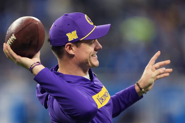 Minnesota Vikings head coach Kevin O'Connell helps his team warm up before an NFL football game against the Detroit Lions, Sunday, Jan. 5, 2025, in Detroit. (AP Photo/Charlie Riedel)