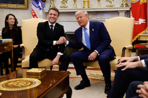 President Donald Trump, right, meets with France's President Emmanuel Macron in the Oval Office of the White House in Washington, Monday, Feb. 24, 2025. (Ludovic Marin/Pool via AP)