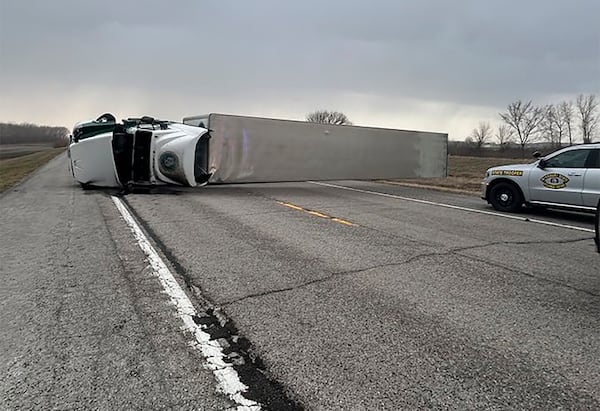 This photo provided by the Missouri State Patrol shows a tractor-trailer overturned by high winds on highway MO-210 in Ray County, Missouri, on Friday, March 14, 2025.(Missouri State Patrol via AP)