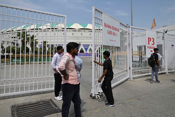 A security guard closes the gate of Atal Bihari Vajpayee Ekana Cricket Stadium after organizers suspended the Indian Premier League for one week following the escalating military tensions with Pakistan, in Lucknow, India, Friday, May 9, 2025. (AP Photo)