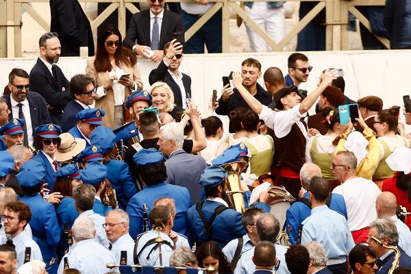 Marine Le Pen stands in the crowd at St. Peter's Square at the Vatican where newly elected Pope Leo XIV delivered his first Sunday blessing from the central balcony of St. Peter's Basilica Sunday, May 11, 2025. (Cecilia Fabiano/LaPresse via AP)