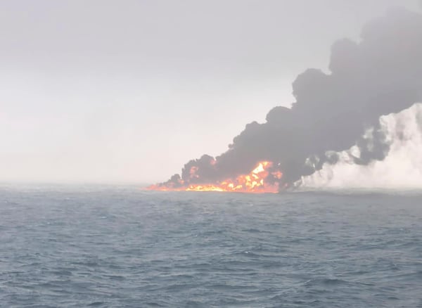 This image provided by Bartek Śmiałek shows smoke billowing from a vessel after a cargo ship hit a tanker carrying jet fuel off eastern England on Monday, March 10, 2025 setting both ablaze and sending fuel pouring into the North Sea. (Bartek Śmiałek via AP)