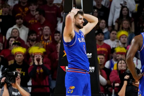 Kansas center Hunter Dickinson reacts after being called for a foul during the first half of an NCAA college basketball game against Iowa State Wednesday, Jan. 15, 2025, in Ames, Iowa. (AP Photo/Charlie Neibergall)