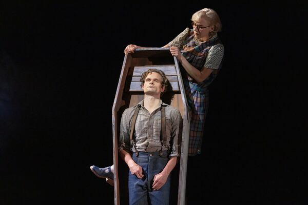 This image released by DKC/O+M shows Andrew Durand, center, with Julia Knitel, during a performance of “Dead Outlaw." (Matthew Murphy/DKC/O+M via AP)