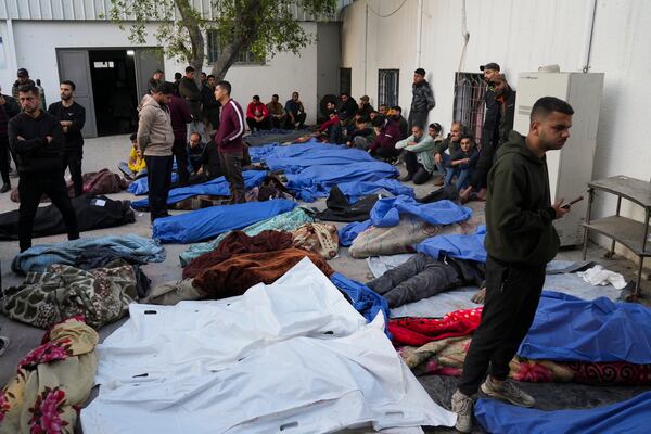 The bodies of Palestinians killed in an Israeli army airstrikes are brought to Shifa hospital in Gaza City, Tuesday, March 18, 2025. (AP Photo/Abdel Kareem Hana)