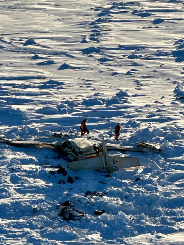 This photo provided by the U.S. Coast Guard on Friday, Feb. 7, 2025, shows a small commuter plane that crashed in western Alaska on a flight that was bound for the hub community of Nome. (U.S. Coast Guard via AP)