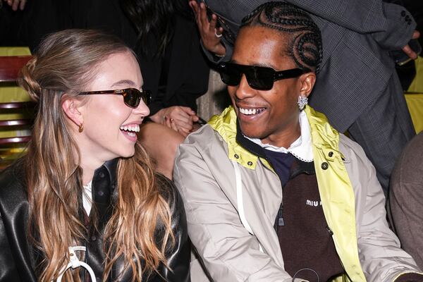 Sydney Sweeney, left, and A$AP Rocky attend the Miu Miu Fall/Winter 2025-2026 Womenswear collection presented Tuesday, March 11, 2025. in Paris. (Photo by Scott A Garfitt/Invision/AP)