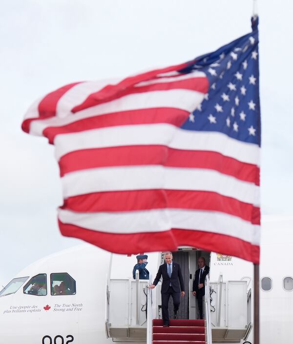 Canada's Prime Minister Mark Carney disembarks a government plane Monday May 5, 2025, as he arrives in Washington, to meet with President Donald Trump. (Adrian Wyld/The Canadian Press via AP)