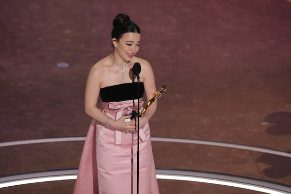 Mikey Madison accepts the award for best performance by an actress in a leading role for "Anora" during the Oscars on Sunday, March 2, 2025, at the Dolby Theatre in Los Angeles. (AP Photo/Chris Pizzello)