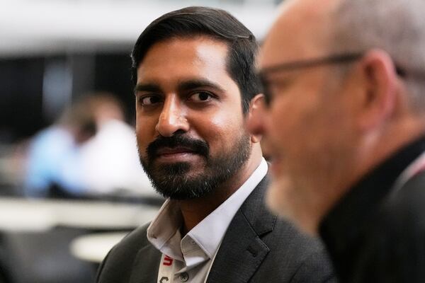 Pras Velagapudi, left, chief technology officer at Oregon-based Agility Robotics, listens during an interview at the Robotics Summit & Expo, Wednesday, April 30, 2025, in Boston. (AP Photo/Charles Krupa)