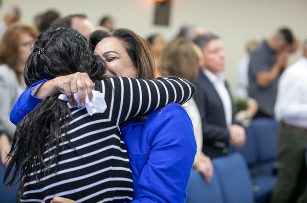 Fatima Guzman, right, embraces Lucy Rodriquez at the end of a church service at the Centro Cristiano El Pan de Vida, a mid-size Church of God of Prophecy congregation in Kissimmee, Florida, Sunday, Feb. 2, 2025. (AP Photo/Alan Youngblood)