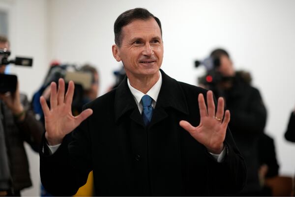 Presidential candidate Dragan Primorac prepares to cast his vote during a runoff vote for the Croatian presidential election at a polling station in Zagreb, Croatia, Sunday, Jan. 12, 2025. (AP Photo/Darko Bandic)