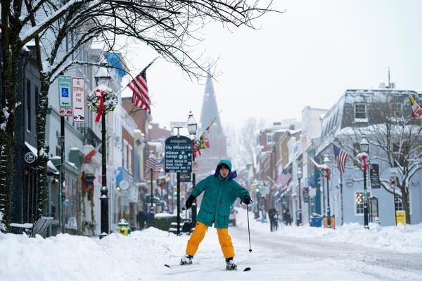 FILE - Cosimos Cendo, of Washington, D.C., skis down Main Street in Annapolis, Md., Monday, Jan. 6, 2025, during a snow storm. (AP Photo/Susan Walsh, File)