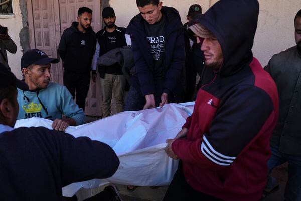 People carry the bodies of Palestinians killed in the Israeli bombardment of the Gaza Strip as they are brought for burial at Al-Aqsa Hospital in Deir al-Balah, Wednesday, March 19, 2025. (AP Photo/Abdel Kareem Hana)