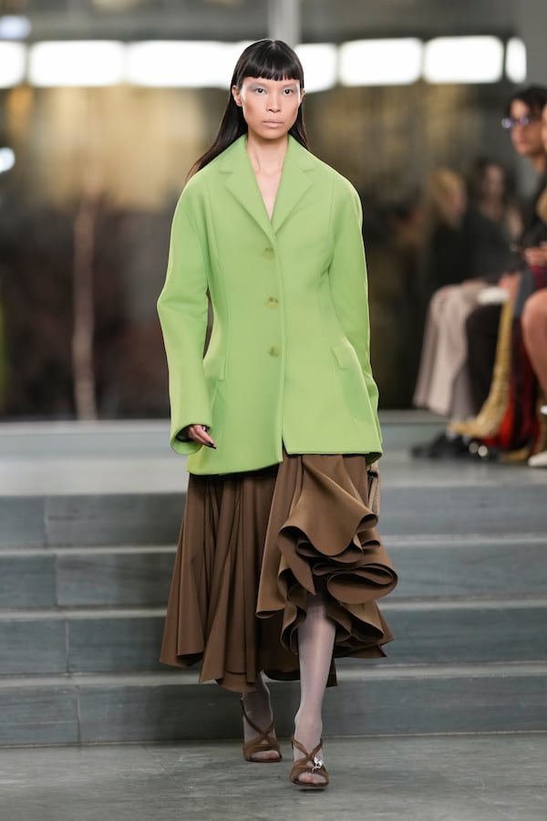 A model walks the runway during the Tory Burch Fall/Winter 2025 fashion show as part of New York Fashion Week on Monday, Feb. 10, 2025, at the Museum of Modern Art in New York. (Photo by Charles Sykes/Invision/AP)