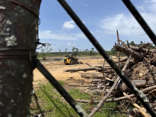 Debris still covers the ground at the Paradise Ranch RV Resort in the Tylertown, Miss., on Thursday, May 15, 2025, two months after a tornado decimated the community. (AP Photo/Sophie Bates)