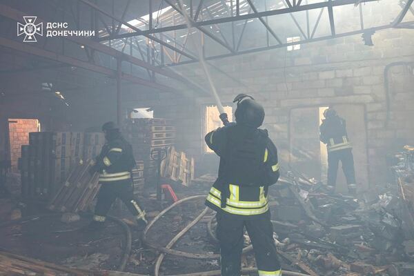 In this photo provided by the Ukrainian Emergency Service, firefighters put out the fire at a storehouse following a Russian attack in Kostiantynivka, Donetsk region, Ukraine, Thursday, March 20, 2025. (Ukrainian Emergency Service via AP)