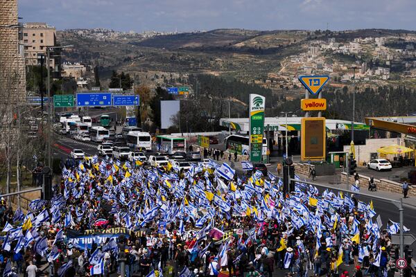 Israelis march in a protest against Prime Minister Benjamin Netanyahu and his plans to dismiss the head of the Shin Bet internal security service, in Jerusalem on Wednesday, March 19, 2025. (AP Photo/Ohad Zwigenberg)