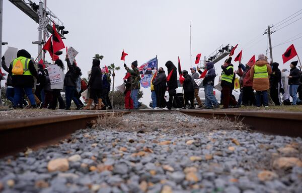 Supporters of President-elect Donald Trump honk as they past a group from La Union del Pueblo Entero (LUPE), meaning The Union of the Entire People, marching to protest the inauguration of President-elect Trump, Monday, Jan. 20, 2025, in McAllen, Texas. (AP Photo/Eric Gay)