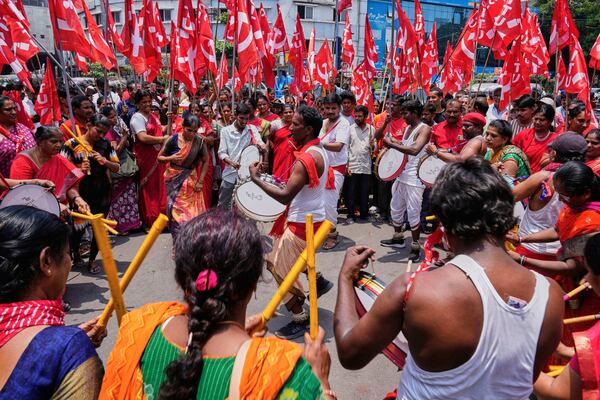 Members of Centre of India Trade Unions (CITU) beat drums and dance as they participate in a rally to mark May Day in Hyderabad, India, Thursday, May 1, 2025. (AP Photo/Mahesh Kumar A.)
