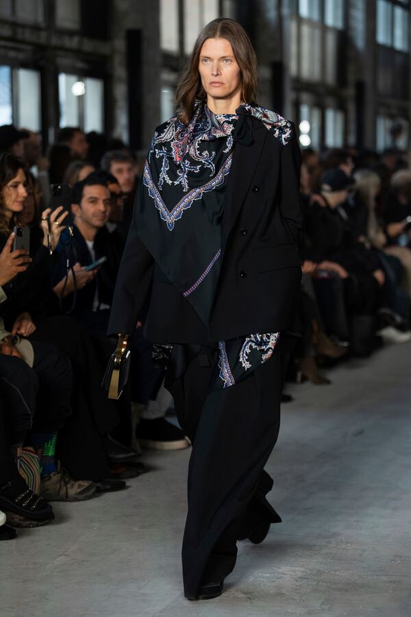 A model wears a creation as part of the Sacai Fall/Winter 2025-2026 Womenswear collection presented in Paris, Monday, March 10, 2025. (Photo by Scott A Garfitt/Invision/AP)