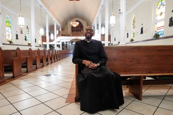 Reverend Ajani K. Gibson, pastor of St. Peter Claver, a Catholic Church in the 7th Ward neighborhood where the grandparents of Pope Leo XIV lived, speaks with The Associated Press inside the Church in New Orleans, Friday, May 9, 2025. (AP Photo/Gerald Herbert)