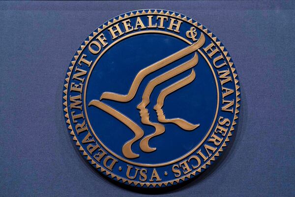 FILE - The Health and Human Services seal is seen before a news conference with Secretary Robert F. Kennedy Jr. in Washington, April 16, 2025. (AP Photo/Jose Luis Magana, File)