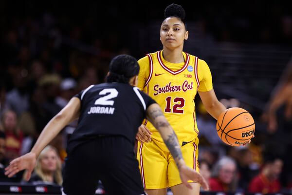 Southern California guard JuJu Watkins (12) controls the ball against Mississippi State guard Jerkaila Jordan (2) during the first half in the second round of the NCAA college basketball tournament Monday, March 24, 2025, in Los Angeles. (AP Photo/Jessie Alcheh)