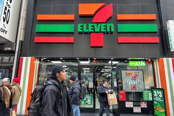 FILE - People shop at a 7-Eleven convenience store in New York, Tuesday, March 19, 2024. (AP Photo/Ted Shaffrey, File)