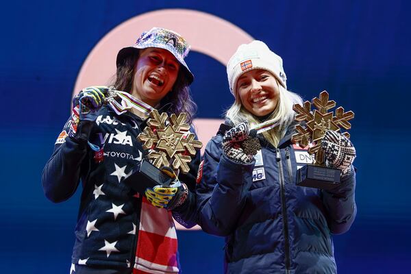 United States' Lauren Macuga, left, and Norway's Kajsa Vickhoff Lie show their joint bronze medals in a women's Super-G, at the Alpine Ski World Championships, in Saalbach-Hinterglemm, Austria, Thursday, Feb. 6, 2025. (AP Photo/Gabriele Facciotti)