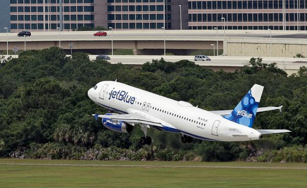 FILE - A JetBlue Airways Airbus A320-232 takes off from the Tampa International Airport in Tampa, Fla., May 15, 2014 (AP Photo/Chris O'Meara, File)