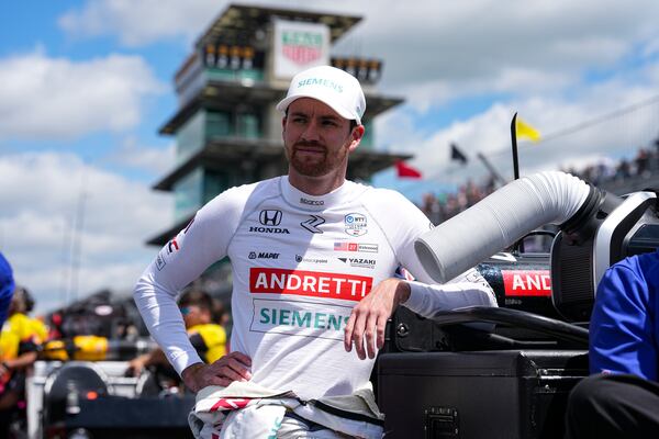 Kyle Kirkwood leans on a tool box as he waits for is turn during qualification for the Indianapolis 500 auto race at Indianapolis Motor Speedway in Indianapolis, Saturday, May 17, 2025. (AP Photo/Michael Conroy)